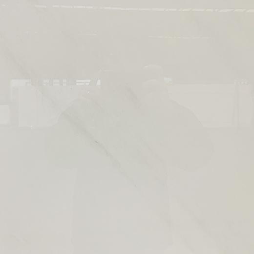 Polished white sintered stone cook top backsplash